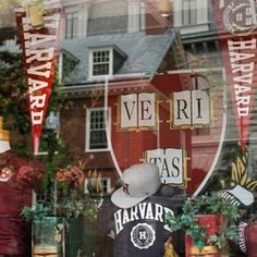 a store front window with mannequins in the window