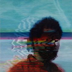 a blurry image of a man's face in the water