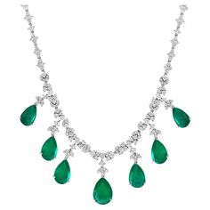 GIA Certified Pear Zambian Emerald & Diamond Bridal Drop Necklace 14 Karat white Gold 14 karat white gold natural Zambian and diamond necklace, consisting of 7 Pear shape Emeralds with a total carat weigh of 35 carats, with round brilliant cut round diamonds .All prong set and dangling from a 16 inch diamond necklace, consisting of 3 groups of diamonds, with a total carat weight of 14 carats, F-G Color, VS1, VS2 clarity with no color enhancement. One randomly piece 1st closest to center was give Zambian Emerald, Zambia, Dream Jewelry, Drop Necklace, Gold Jewelry Fashion, Emerald Diamond, High Jewelry, Pear Shape, 20 Years