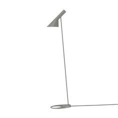 a white floor lamp with a black base and a grey shade on the top, against a white background