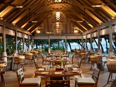 the inside of a restaurant with tables and chairs set up for an outdoor dining area