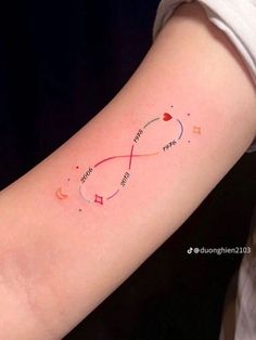 a woman's arm with an infinite love tattoo on it