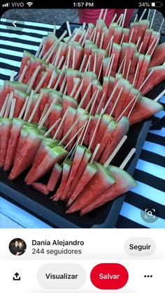 watermelon skewers are arranged on a tray