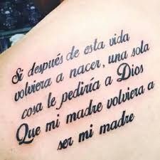 the back of a woman's tattoo with words written in spanish and english on it