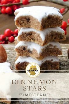 cinnamon stars are stacked on top of each other with icing and nuts in the background