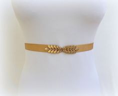 Gold leaf belt. Elastic waist belt. Dress belt. Stretch belt. Grecian belt. Wedding belt. Bridal belt. Greek belt. Bridesmaids belt. ❤ Sizes:  XS-S: fits to waist size from 27 to 29 (67cm - 72cm)  M-L: fits to waist size from 29 to 31 (72cm - 77cm)  XL: fits to waist size from 31 to 33 (77cm - 82cm)  Custom Size: If youre not sure about size or need a different size please write your waist measurement in the message box at checkout and Ill fit the belt to the requested size with no additional... Gold Fitted Belt, Elegant Gold Corset Belt For Parties, Chic Gold Belt For Summer, Gold Fitted Belt For Formal Occasions, Elegant Rope Belt For Spring, Formal Fitted Gold Belt, Gold Adjustable Belt For Spring, Gold Belt For Party Occasions In Spring, Adjustable Elegant Corset Belt