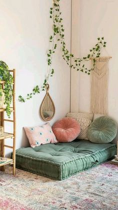 a living room filled with furniture and plants