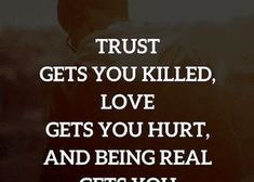 a man standing in front of a window with the words trust gets you killed, love gets