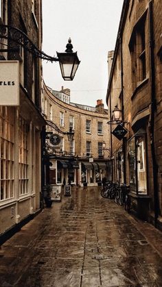 an empty city street is shown in the rain