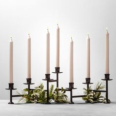 a group of lit candles sitting next to each other