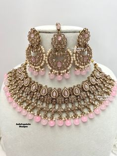 Gorgeous Antique gold Polki Necklace Set comes with beautiful earrings and tikka / Indian Jewelry/ High Quality Kundan and Polki Jewelry/ Bollywood Jewelry/Wedding Jewelry/baby pink  All items are shipped from Brampton, Ontario, Canada. If you need your item by a certain day, please reach out to us for express delivery option before placing the order so that we can update the shipping for you. Standard shipping/delivery timeline Below are the estimated delivery times after the order is shipped/d Pink Bridal Sets For Party And Festive Occasions, Pink Bridal Sets For Party, Festive Pink Bridal Sets For Party, Pink Jewelry Sets For Diwali Party, Pink Necklace With Intricate Design For Festive Occasions, Pink Stone Work Tikka As Gift, Pink Necklaces With Intricate Design For Festive Occasions, Festive Pink Necklace With Intricate Design, Bollywood Style Pink Tikka With Stone Work