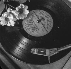 an old record player with flowers on it