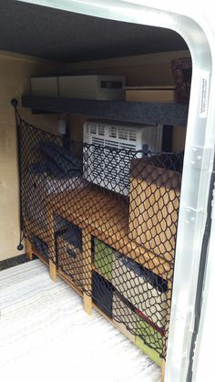 the inside of an rv with several storage bins