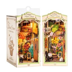 two cardboard boxes that are open to show the front and back of a dollhouse