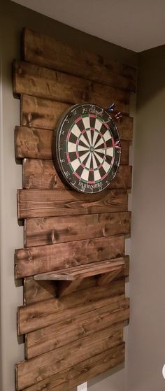 a dart board mounted to the side of a wall