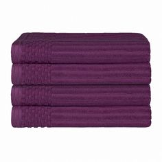 three purple towels stacked on top of each other