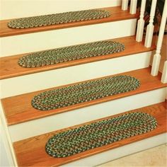 carpeted stair treads on the bottom of a set of stairs