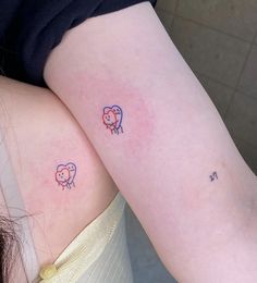 two small sheep tattoos on the back of their thighs, one with a cross in it's left arm