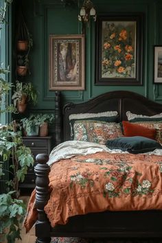 a bedroom with green walls and lots of plants