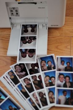 several polaroid photos are placed next to a printer