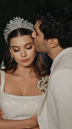 a bride and groom kissing each other