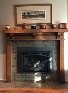 a fireplace with some bowls on top of it