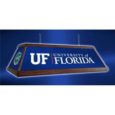 the university of florida sign hanging from a chain on a blue background with an underbelly