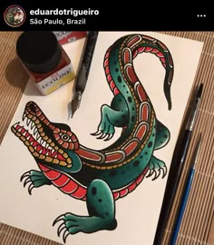 a drawing of a lizard on paper with markers