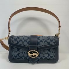 Coach tabby sling crossbody C4064 4064 Denim signature gold hardware￼. Denim Designer Bag, Coach Denim Bag, Coach Hamdbags, Coach Denim Shoulder Bag, Luxury Blue Coach Shoulder Bag, Coach Blue Shoulder Bag, Coach Monogram, Coach Tabby, Leather And Denim