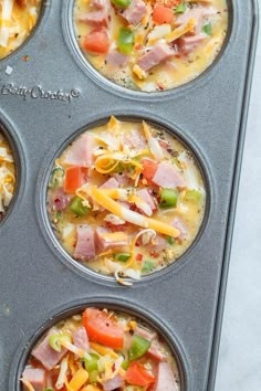 four muffin tins filled with different types of food in them and ready to be baked