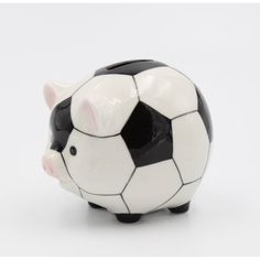 a piggy bank with a soccer ball painted on it's face, sitting in front of a white background