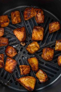 chicken and pineapples cooking in a cast iron skillet