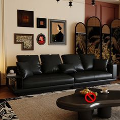 a living room filled with black leather furniture