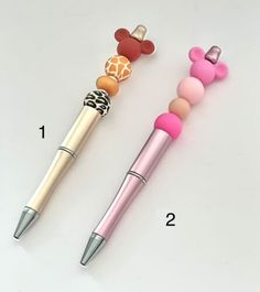 three different types of pens on a white surface with the numbers 1, 2, and 3