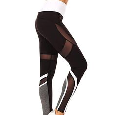 a woman in black and white leggings with mesh detailing on the side,