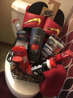 a basket filled with personal care items sitting on top of a toilet