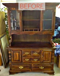 an old wooden china cabinet with glass doors