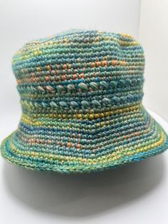 a multicolored hat sitting on top of a white table