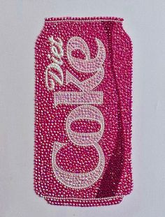 a pink soda can with the word coke on it