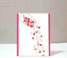 a card that has hearts coming out of it