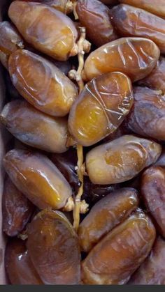 some kind of food that is in a cardboard box on the table and it looks like beans