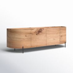 the sideboard is made out of wood and has metal legs on each side,