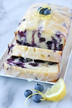 lemon blueberry bread on a white plate with the words lemon blueberry bread above it