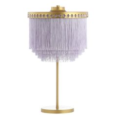 a purple lamp on a gold stand with fringes hanging from it's sides