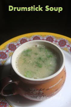 a bowl of soup sitting on top of a plate