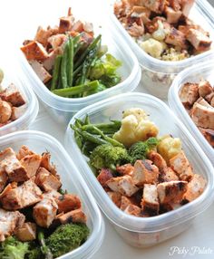 six plastic containers filled with food on top of a white countertop next to green beans and broccoli