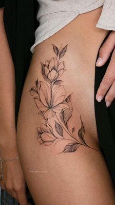 a woman's stomach with flowers on it