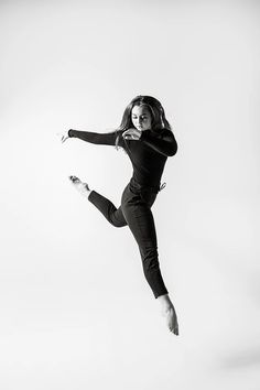 black and white photograph of a woman jumping in the air