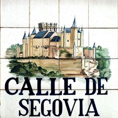 a tile sign that says calle de segovia with a castle in the background