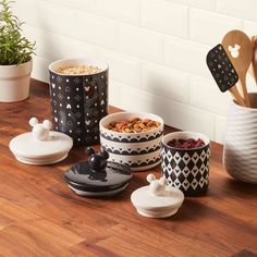 various bowls and spoons on a wooden table